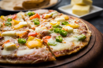 Chapati Pizza made using leftover Roti / Paratha with Cheese, vegetables, paneer and Sausage