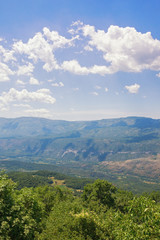 Obraz premium Beautiful mountain landscape on sunny summer day. Montenegro, Dinaric Alps, view of Bjelopavlici plain near Ostrog monastery