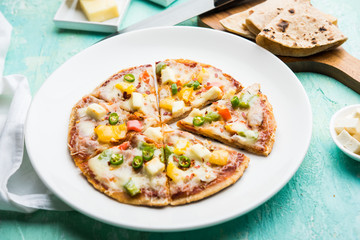 Chapati Pizza made using leftover Roti / Paratha with Cheese, vegetables, paneer and Sausage