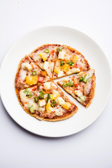 Chapati Pizza made using leftover Roti / Paratha with Cheese, vegetables, paneer and Sausage