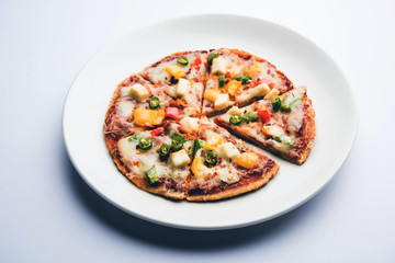 Chapati Pizza made using leftover Roti / Paratha with Cheese, vegetables, paneer and Sausage