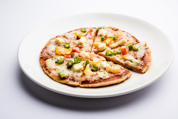 Chapati Pizza made using leftover Roti / Paratha with Cheese, vegetables, paneer and Sausage