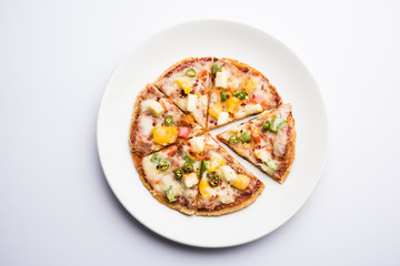 Chapati Pizza made using leftover Roti / Paratha with Cheese, vegetables, paneer and Sausage