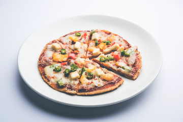 Chapati Pizza made using leftover Roti / Paratha with Cheese, vegetables, paneer and Sausage