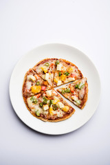 Chapati Pizza made using leftover Roti / Paratha with Cheese, vegetables, paneer and Sausage