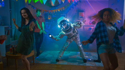 At the College House Costume Party: Fun Guy Wearing Space Suit Dances Off, Doing Robot Dance Modern...