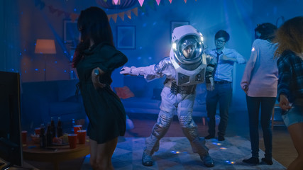 At the College House Costume Party: Fun Guy Wearing Space Suit Dances Off, Doing Robot Dance Modern...