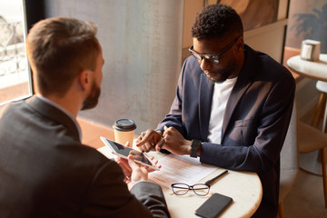 Two businessmen having a meeting to discuss a new project they planned.