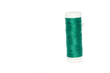 green thread spool, isolated on white background