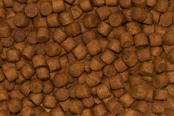 Background, texture of granulated animal feed.