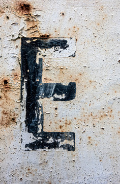 Written Wording in Distressed State Typography Found Letter E