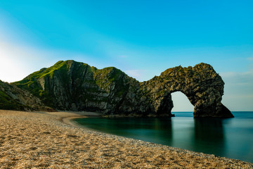 Durdle Door rock in Jurassic Coast in south England with a nicely blurred sea by a long exposure shot