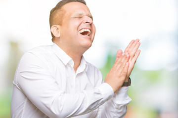 Middle age arab elegant man over isolated background Clapping and applauding happy and joyful, smiling proud hands together