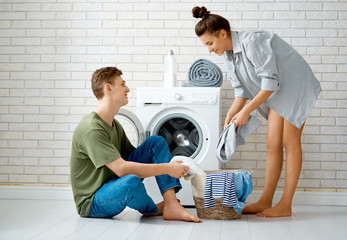 loving couple is doing laundry