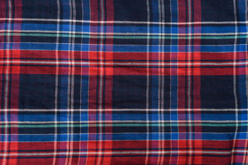 Blue with red checkered seamless fabric. Textural background