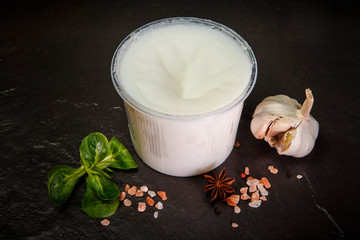 white cream lard in plastic bowl served garlic with basil leaf - obrazy, fototapety, plakaty