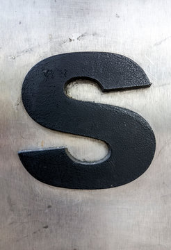 Written Wording in Distressed State Typography Found Letter S