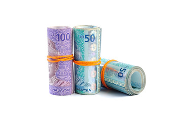 50 and 100 Malaysian Ringgit banknotes tied with rubber-band