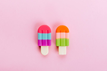 USB flash drive flash in the form of ice creamon a pink background.