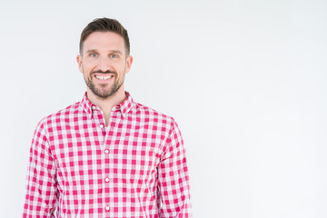 Obraz premium Young handsome man wearing shirt over isolated background with a happy and cool smile on face. Lucky person.
