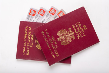 Fototapeta premium Polish passport and ID card on a white table. Personal documents from a European country.