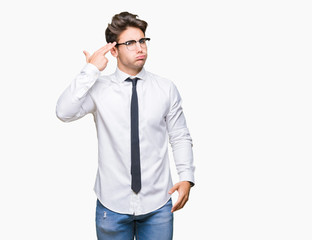 Young business man wearing glasses over isolated background Shooting and killing oneself pointing hand and fingers to head, suicide gesture.