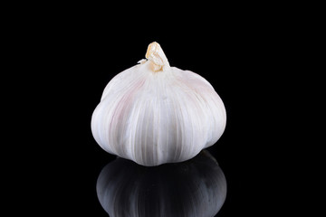 Garlic with reflection on black background