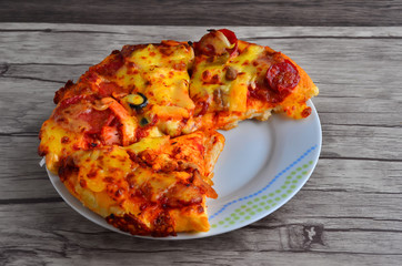 Cheese pizza on wooden  background