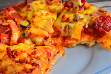 Cheese pizza on wooden  background