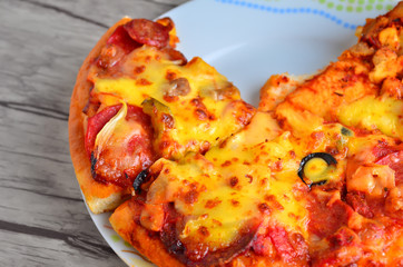 Cheese pizza on wooden  background