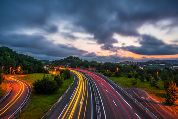 The day ends and we see the wake of the lights of the cars on the highway. Photo in Errenteria...