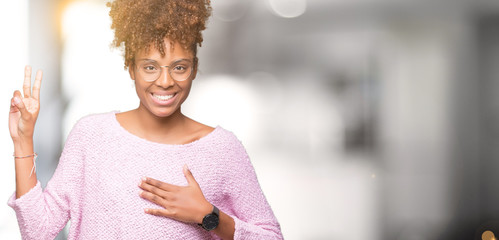 Beautiful young african american woman wearing glasses over isolated background Swearing with hand on chest and fingers, making a loyalty promise oath
