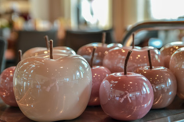 Shining decorative apples placed on the restaurant table for decoration