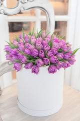 Beautiful Bouquet of flowers in a round hat box on a table
