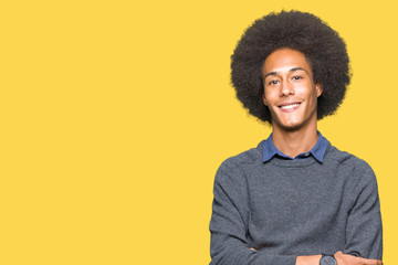 Fototapeta na wymiar Young african american business man with afro hair happy face smiling with crossed arms looking at the camera. Positive person.