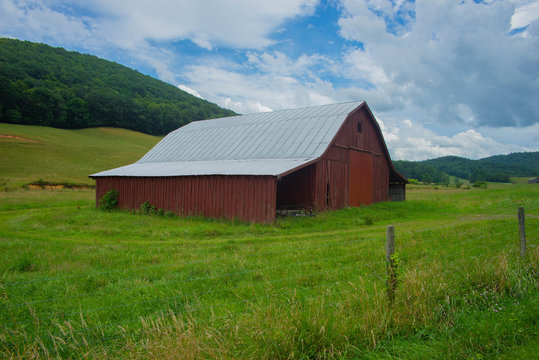 old barn in field