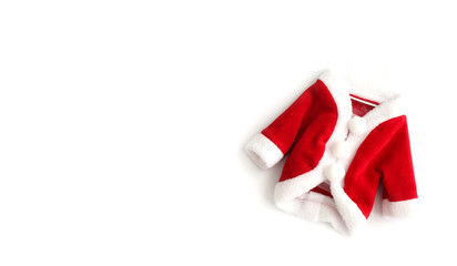 Fototapeta na wymiar Christmas background Santa Claus (Saint Nicholas) red mini coat suit costume white cuffs flat lay isolated on white background. Concept photo for Merry Christmas Winter holidays celebration.