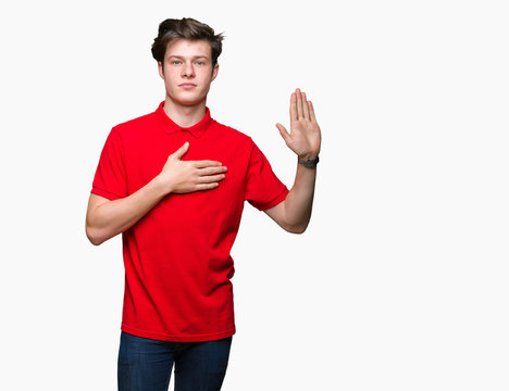 Young handsome man wearing red t-shirt over isolated background Swearing with hand on chest and open palm, making a loyalty promise oath