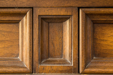 Closeup of wooden frame on cabinet door