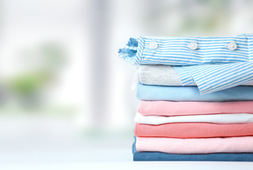 Colorful cotton stack pf clothing empty space background.