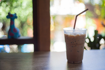 cup of coffee on wooden table