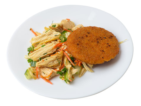 fishcake with soy asparagus and carrots, cucumbers and dilll.  fish cutlet on a plate isolated. cutlet with vegetables top view