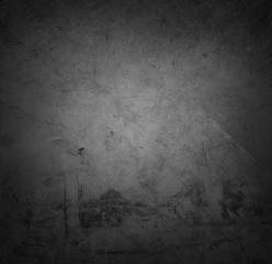 Grey textured concrete wall background. Dark edges