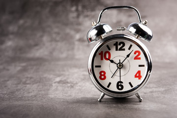 alarm clock retro and vintage classic design on gray background.