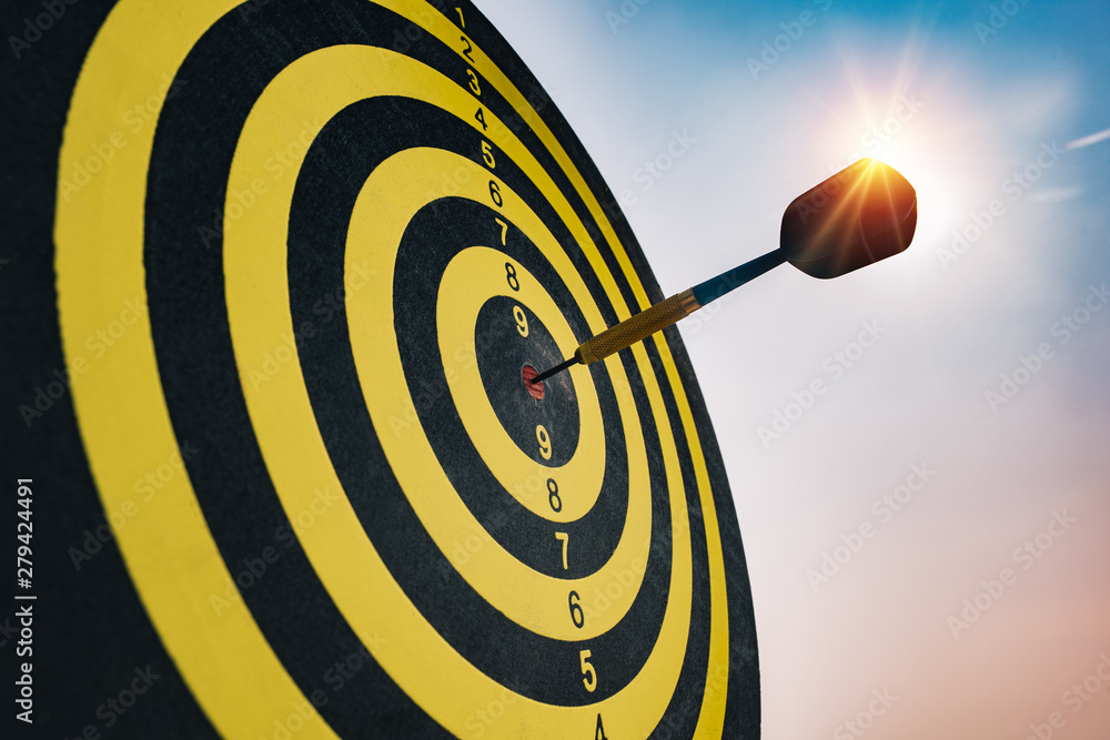 Aufkleber dart arrow hitting in the target center of dartboard.concept bullseye is a target of business.