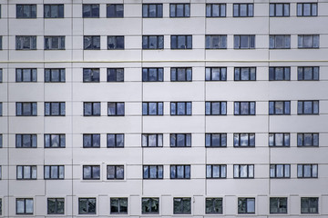 Closeup of many windows in residential high rise building in Minsk, Belarus
