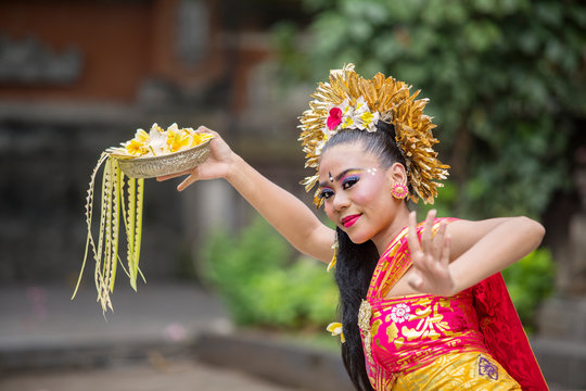 Balinese Pendet Dancer Dancing With Flower