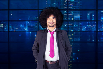 Curly hair businessman standing in the office