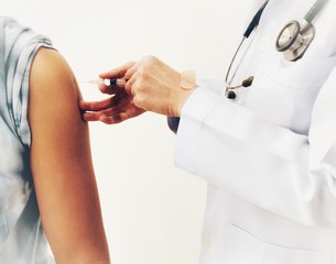 Doctor vaccinating patient. Vaccine used for vaccination and immunization from disease as flu or...