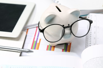  Piggy bank with black glasses, economical and educational concepts